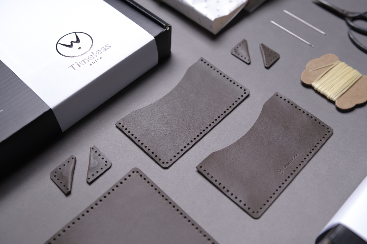 The Timeless White leather DIY kit, with pre-cut leather pieces, waxed thread and tools