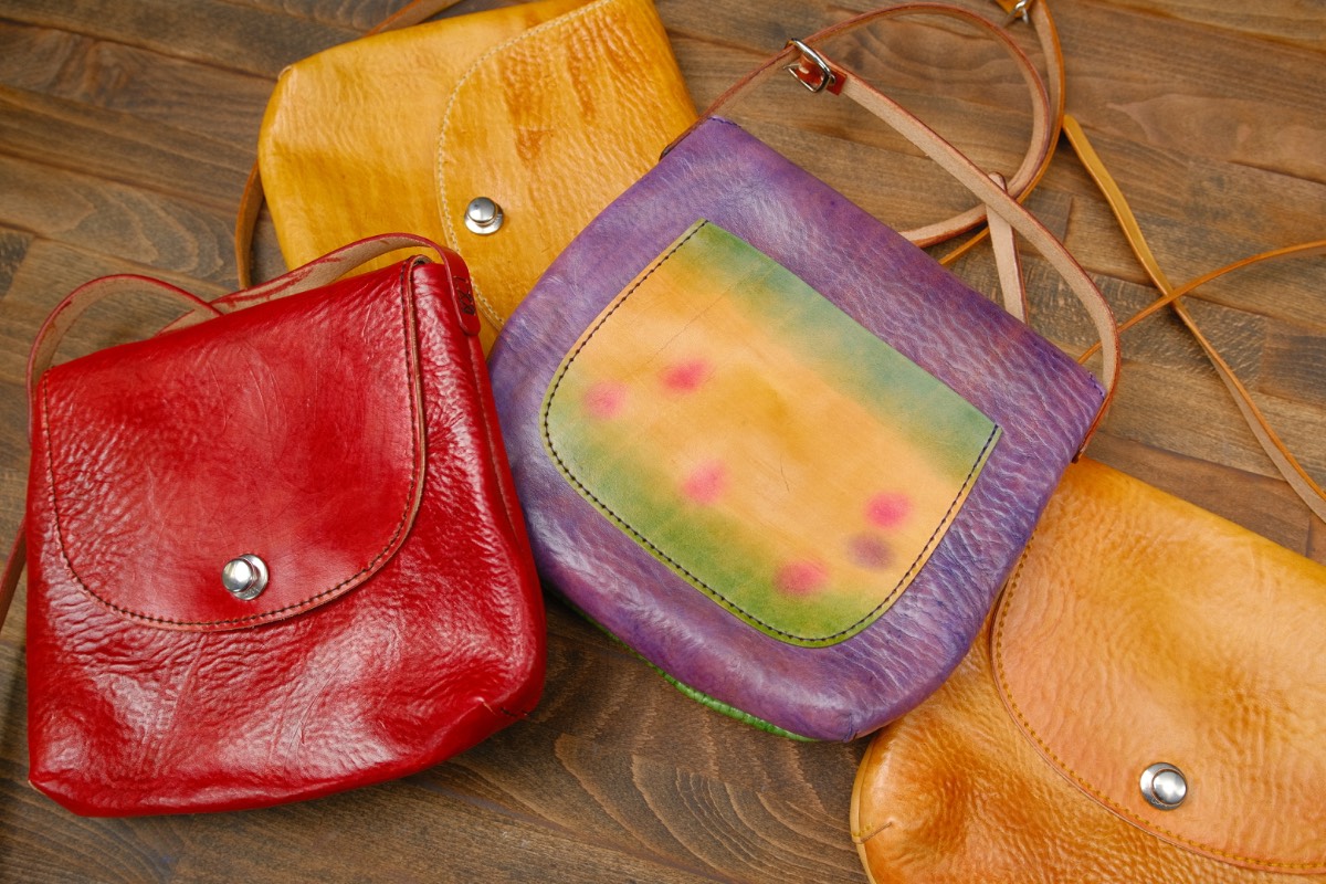 A student's hand-painted leather piece, rich and distinctive in color